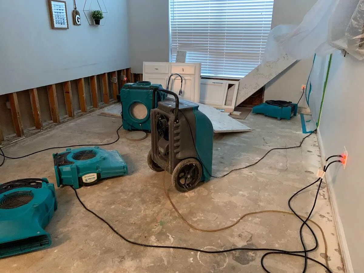 Dehumidifier in flood-cut room for Water Damage Restoration in Red Oak